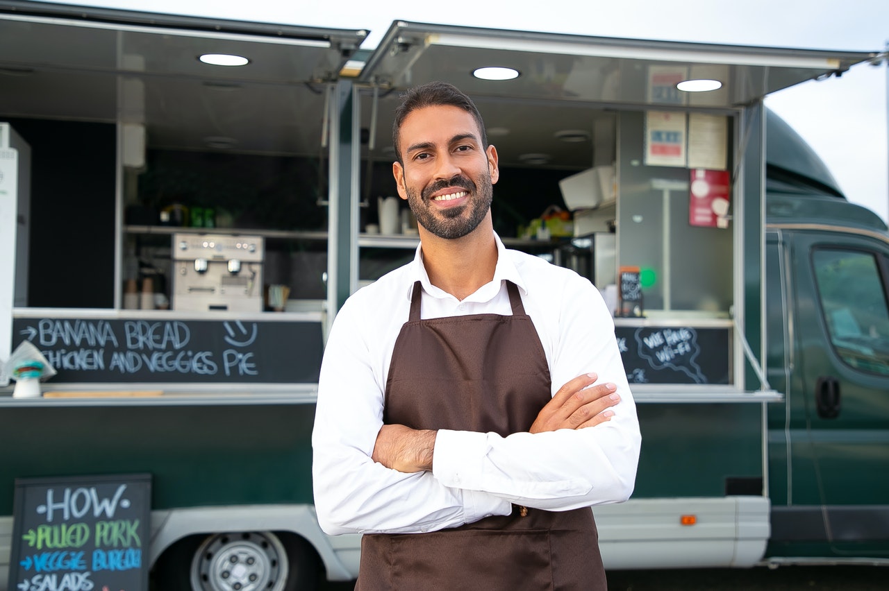 man in front of his food truck